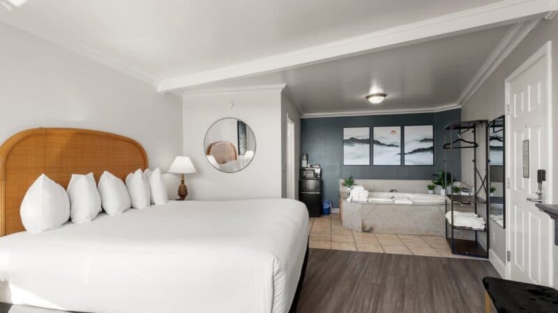 Bright romantic hotel room with a private jetted tub